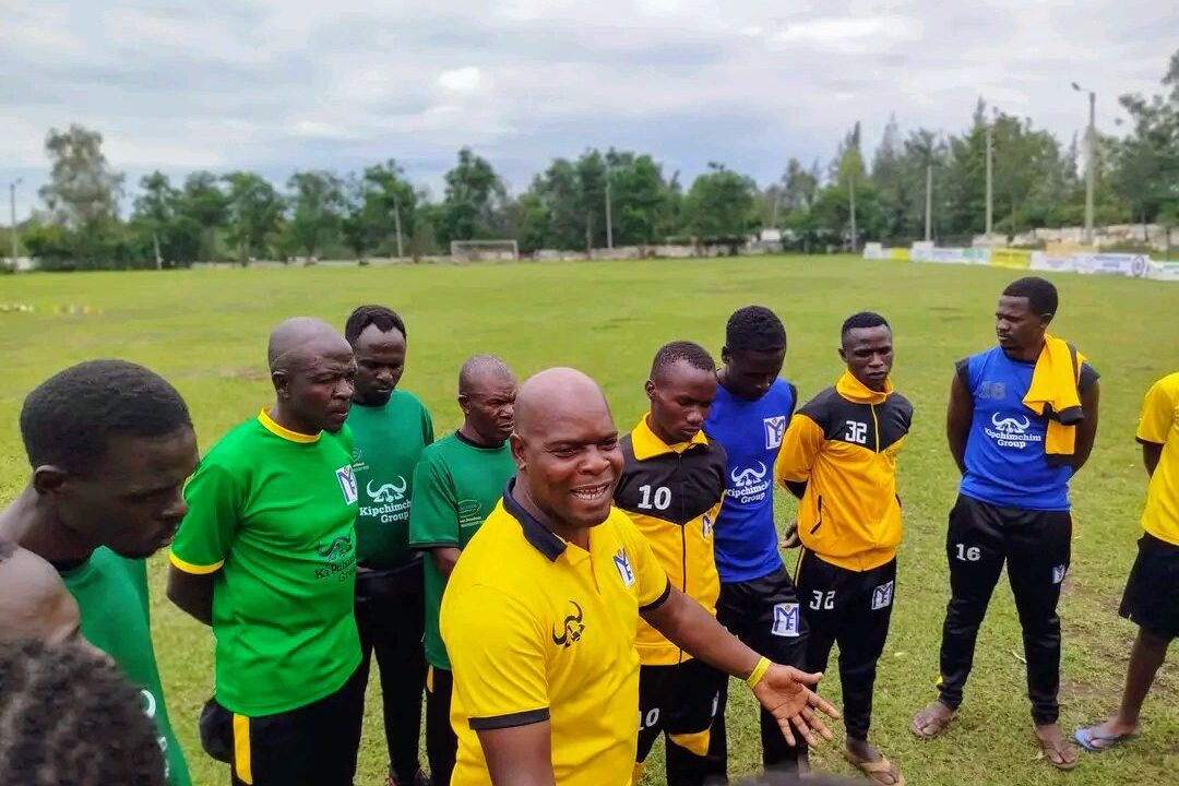 Muhoroni Youth FC chairman Moses Adagala with players during a past match against TBM Health FC.