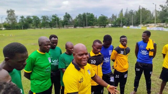 Muhoroni Youth FC chairman Moses Adagala with players during a past match against TBM Health FC.